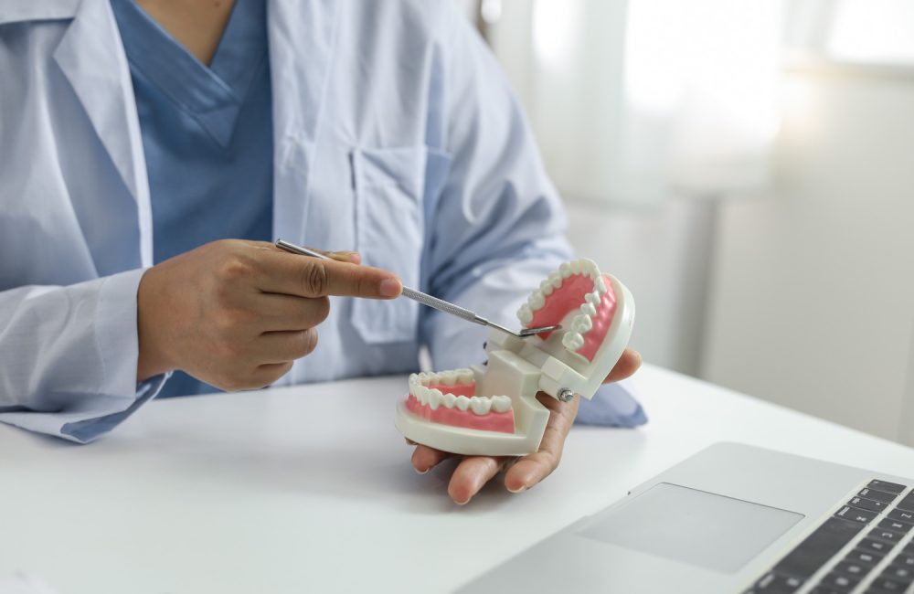 Dentist examining a patient teeth medical treatment at dental clinic